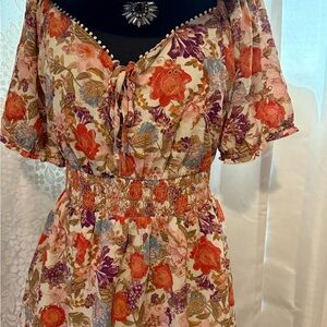 Torrid Floral Blouse with Smocked Waistband and eyelet detailing throughout.